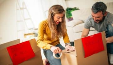 Husband and wife packing boxes