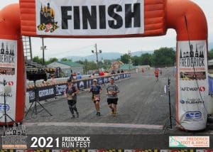 Eileen and Hubby crossing finish line